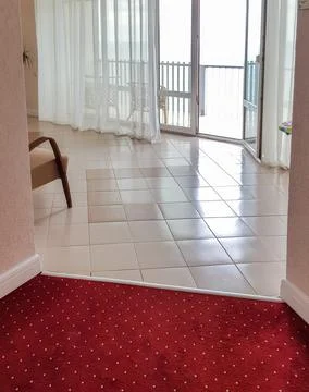 Modern interior of the hotel with a view of the panoramic window with a balco Stock Photos