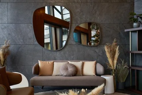 Modern interior with irregularly shaped mirrors Stock Photos