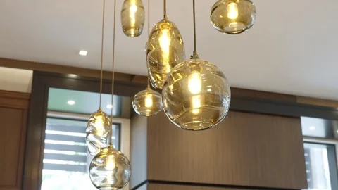 Modern interior lighting fixture with multiple hanging pendant lights. Lights Stock Footage 297751554
