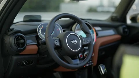Modern interior of premium car with orange leather seats. Crop of luxury saloon Видео 260677059