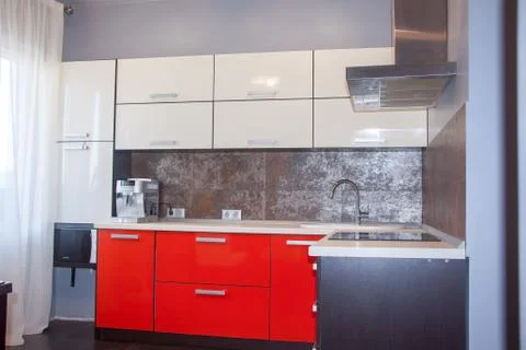 Modern Interior red white kitchen, with metal Stock-Fotos