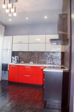 Modern Interior red white kitchen, with metal Stock Photos