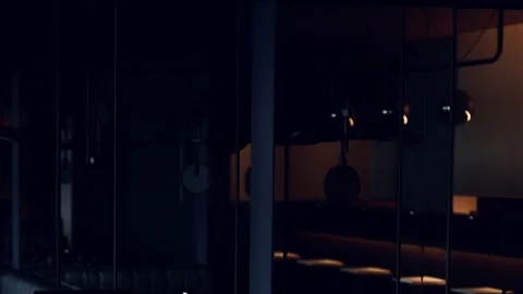 Modern interior of a restaurant during evening hours with dim lighting Stock Footage 344385239