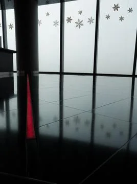 A modern interior shows an illuminated red line contrastin on a black floor  Stock Photos