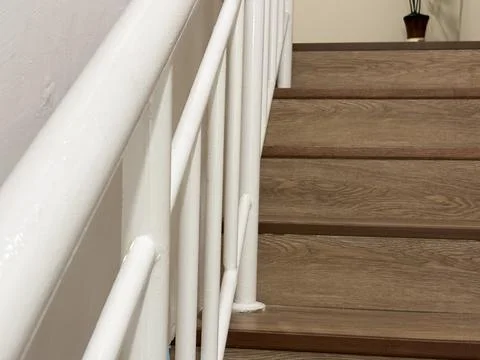 Modern interior view of a staircase featuring wooden steps Stock Photos
