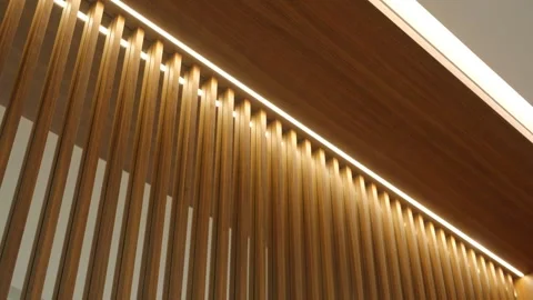 Modern interior wall design featuring vertical wooden slats with integrated Видео 275825507