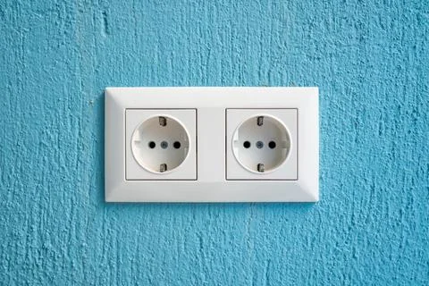 Modern interior wall socket detail showing clean electrical infrastructure Stock Photos