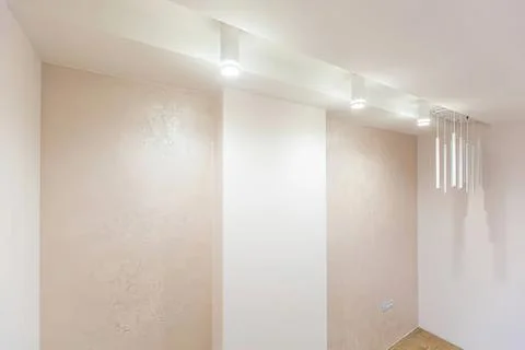 Modern interior wall with soft lighting and textured finish Stock Photos