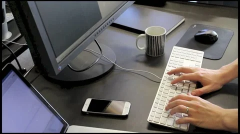 Modern IT Office worker working on two screens Stock Footage 49424614
