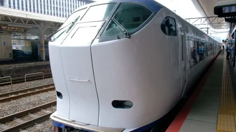 A modern japanese express train stops at Kyoto station. Stock Footage 132014293