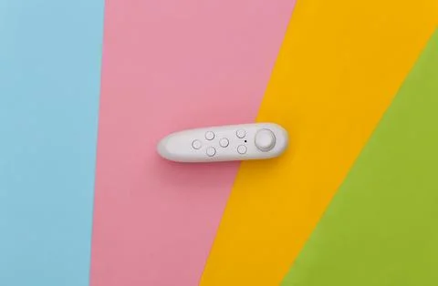 Modern joystick on colored background. Flat lay. Top view Stock Photos