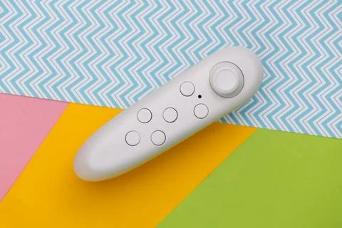 Modern joystick on colored background. Flat lay. Top view Stock Photos