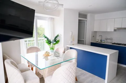 Modern kitchen and dining area interior Stock Photos