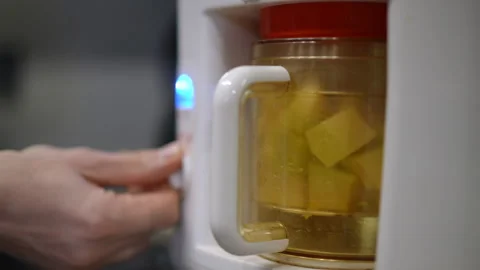A modern kitchen appliance is currently in use for the process of cooking food  Stock Footage 301435724