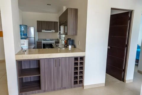 Modern kitchen with breakfast bar and cabinets Stock Photos