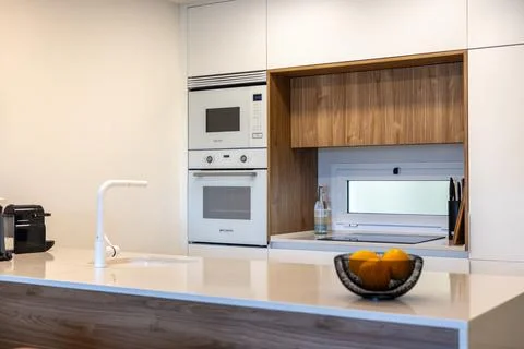 Modern kitchen with built-in appliances Stock Photos