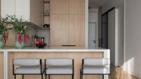 Modern kitchen with cabinet kitchen island chairs and hallway. Modern furniture Stock Footage 312122648