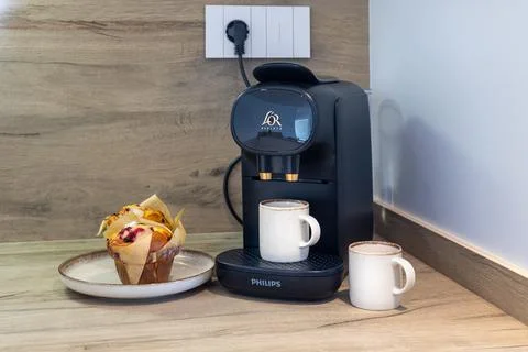 Modern Kitchen Coffee Machine With Cup And Fresh Muffin Stock Photos