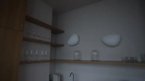 A modern kitchen corner with elegant shelves and decorative elements Vidéo 303826249