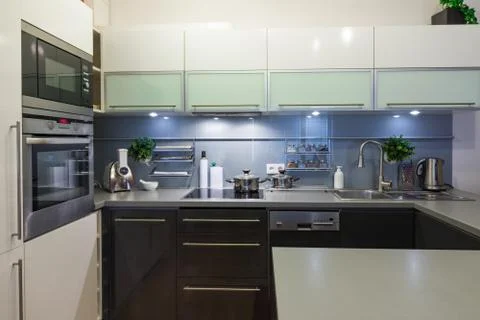 Modern kitchen at home with kitchenware Stock Photos