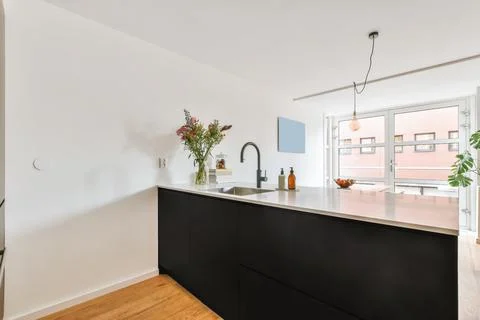 Modern kitchen interior in apartment Stock Photos