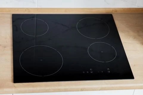 Modern kitchen interior with black induction Foto stock