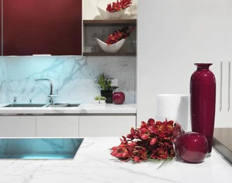 Modern kitchen interior design in white and burgundy colors Stock Photos