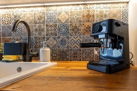 Modern Kitchen Interior with Espresso Coffee Machine on Wooden Countertop a.. Stock Photos