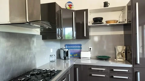 Modern Kitchen Interior with Gray Cabinets and Stainless Steel Appliances Stock Footage 335507851