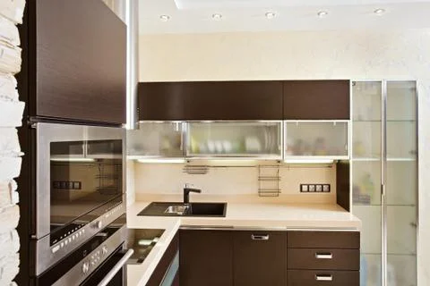 Modern kitchen interior with hardwood furniture Stock Photos