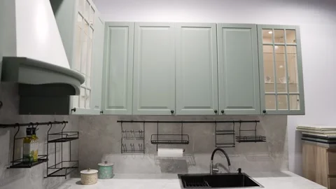 Modern kitchen interior reveal with mint cabinets Stock Footage 337392762