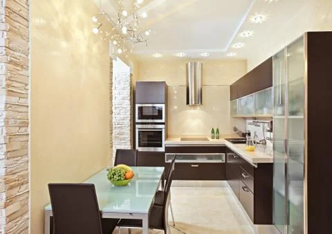 Modern kitchen interior in warm tones Stock Photos