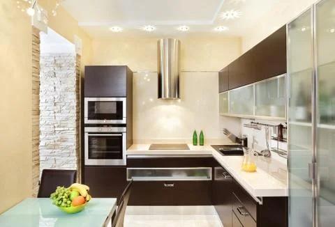 Modern kitchen interior in warm tones Foto stock