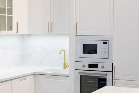 Modern kitchen interior with white cabinets Stock Photos