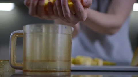 In a modern kitchen, the process of preparing fresh ingredients is both an art Stock Footage 301435825