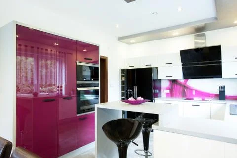 Modern kitchen with purple elements Stock Photos