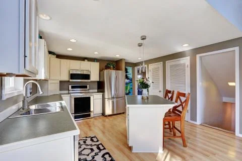 Modern kitchen room interior with stainless steel appliances.  Stock Photos