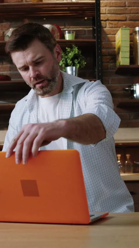 The modern kitchen setting boasts a rustic brick wall and wellorganized, stylish Stock Footage 313778070