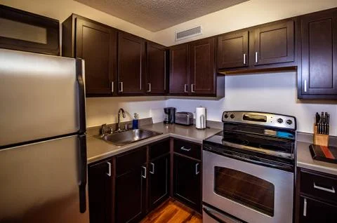 Modern kitchen in shades of brown Stock Photos
