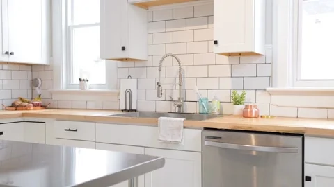 Modern Kitchen Sink with Subway Tile Backsplash and Chrome Appliances Stock Footage 147752275
