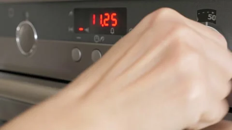 Modern kitchen stove selective focus on temperature dials while programing fo Video stock 50211787