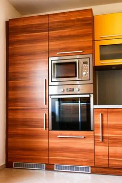 Modern kitchen unit with built-in appliances Stock Photos