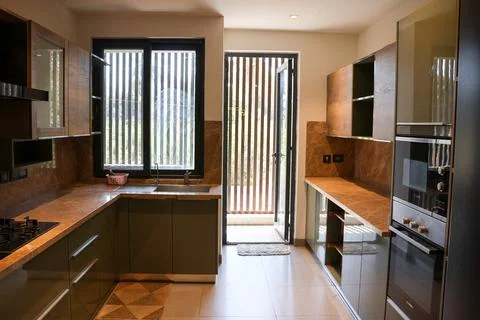 Modern Kitchen with Utility Area Featuring Contemporary Cabinets Stock Photos