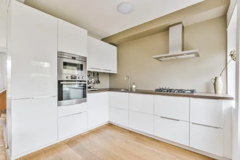 Modern kitchen with white cabinets Stock Photos
