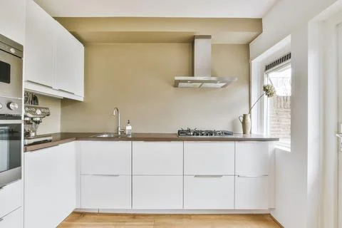 Modern kitchen with white cabinets Stock Photos