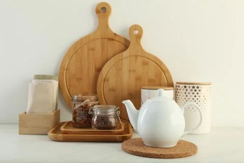 Modern kitchenware and products on white marble table Stock Photos