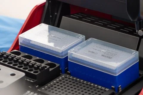 A modern laboratory device with sample containers is used for analysis. Stock Photos