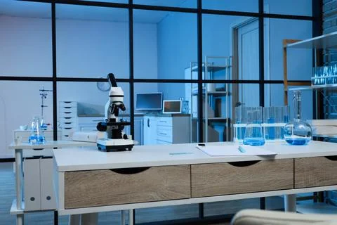 Modern laboratory interior with microscope and scientific equipment for resea Stock Photos