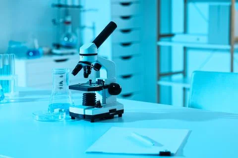 Modern laboratory microscope and scientific equipment on a table for research Stock Photos