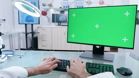 In modern laboratory practitioner types on green screen computer Stock Footage 110900835